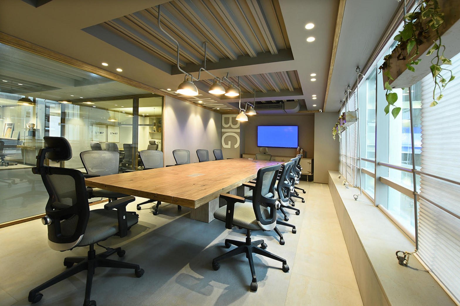 Conference room — long table, glass, daylight