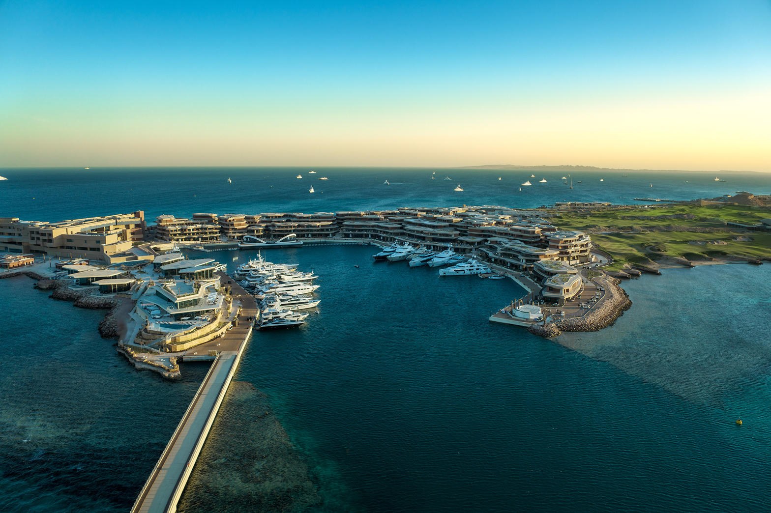 Sindalah harbour and coastal buildings at sunset