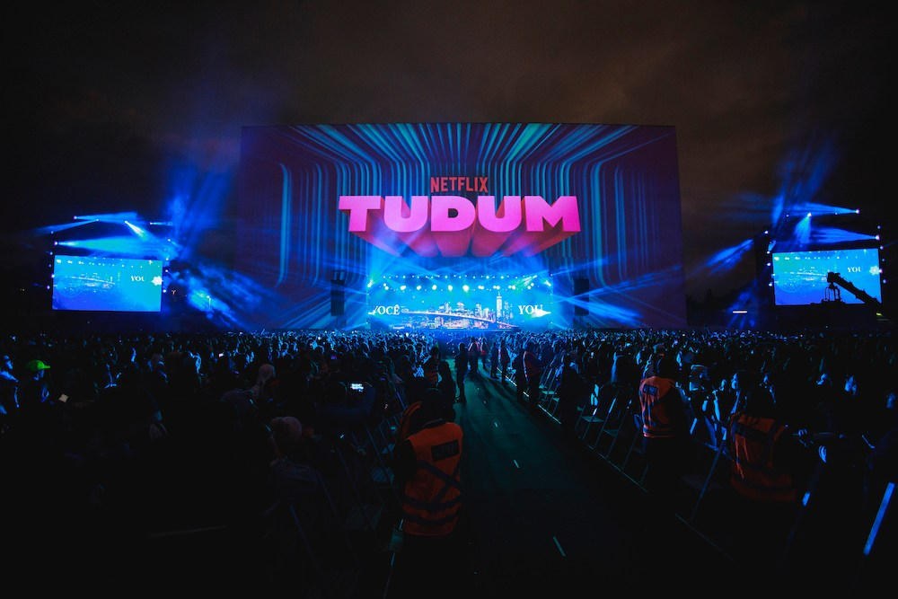 Tudum outdoor stage and crowd under the Netflix Tudum title