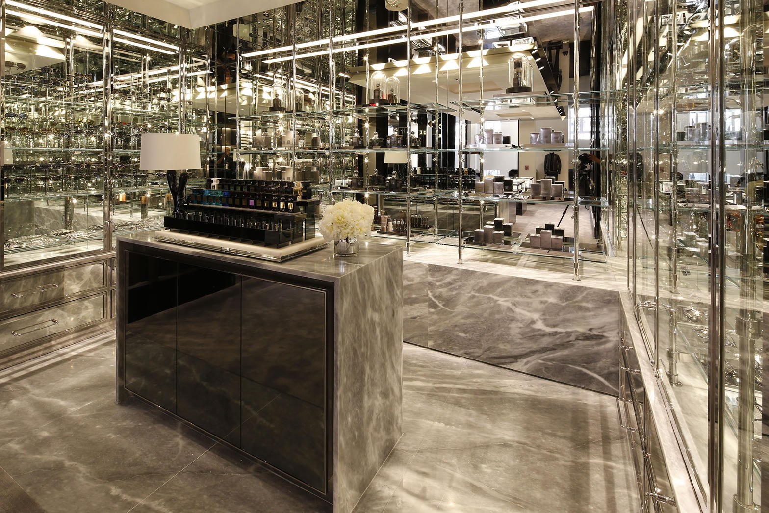 Tom Ford Beauty boutique merchandising — fragrance, marble, chrome